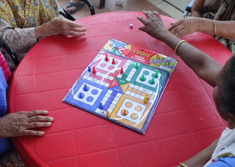 Residents playing Ludo together at Saksham by Kriti
