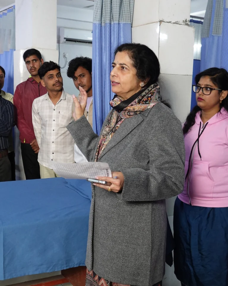 Healthcare team member interacting with visitors and staff at Saksham by Kriti