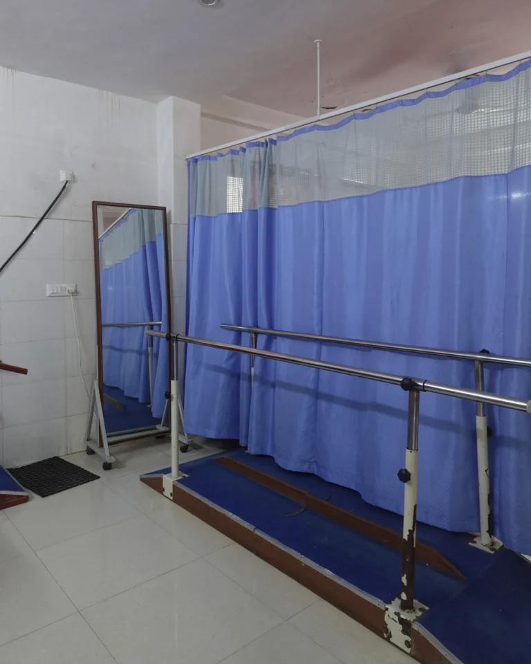 Mobility and rehabilitation area with parallel bars at Saksham by Kriti