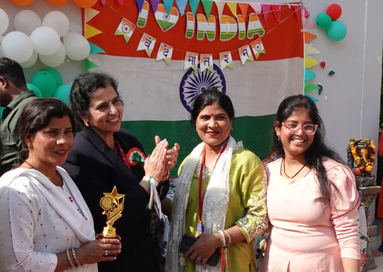 Group celebrating an achievement during an event at Saksham by Kriti